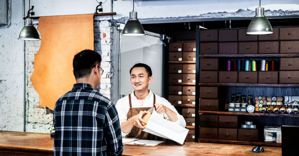 shop owner and customer during a small business transaction