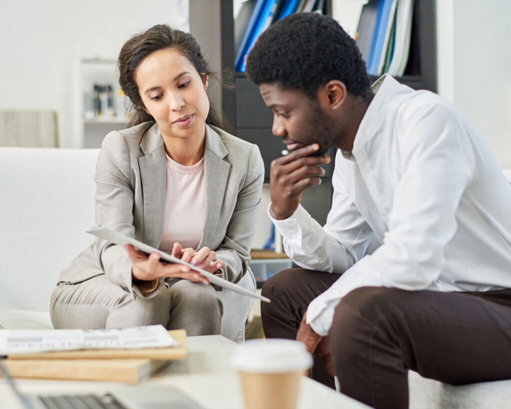 Commercial loan specialist explaining details to a client.