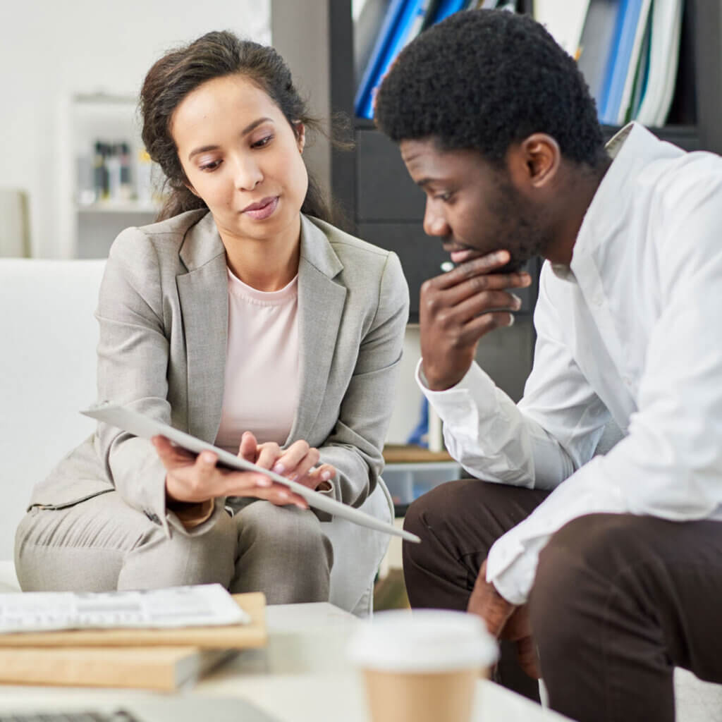 two people looking at a document together