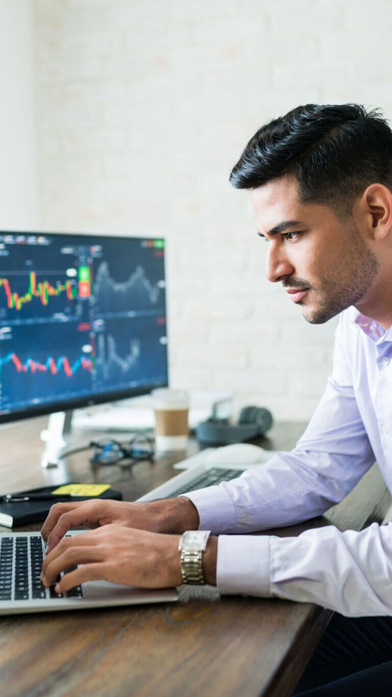 Small business lender working on his laptop.