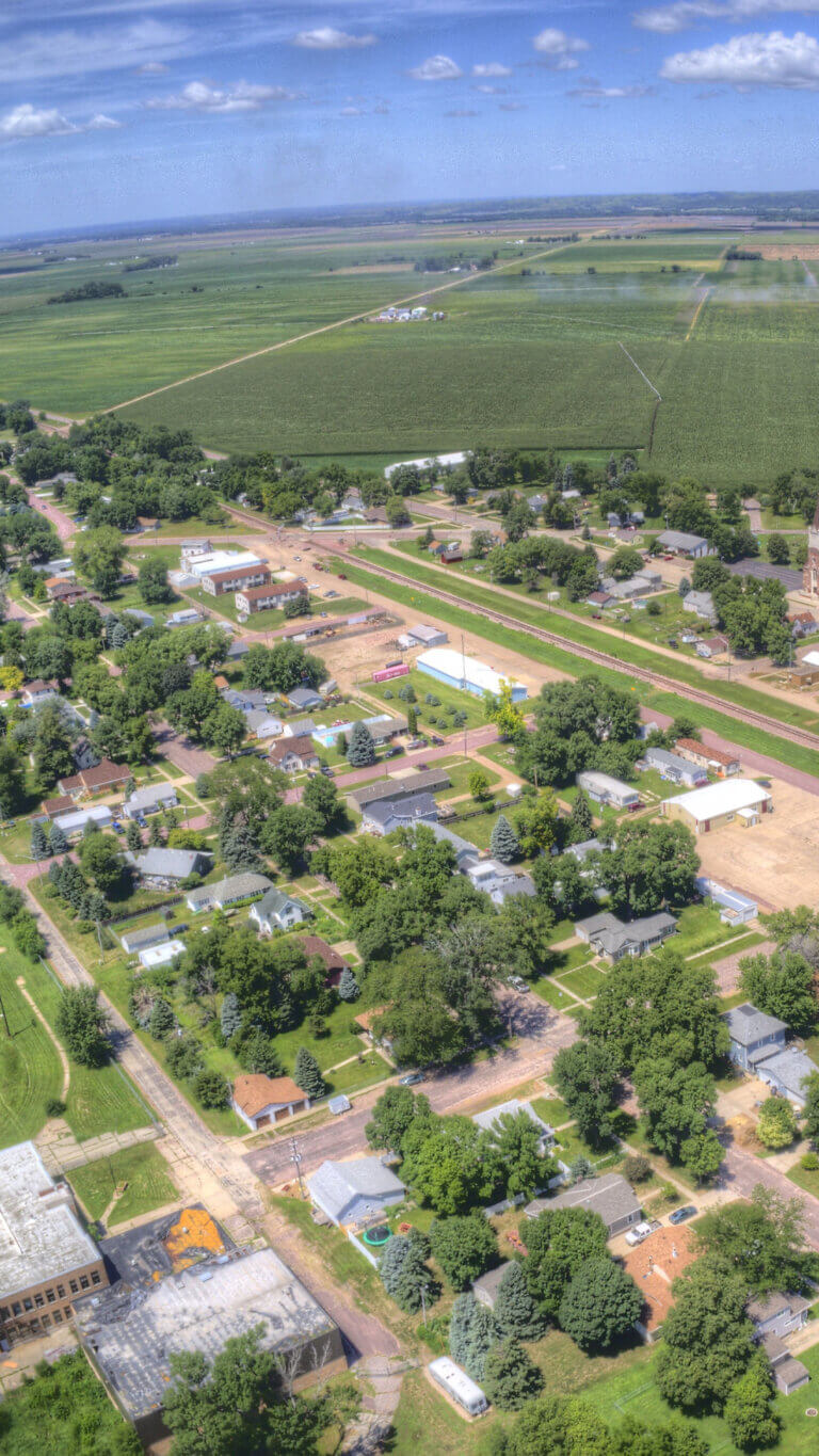 Aerial view of small rural town and surrounding farm land.
