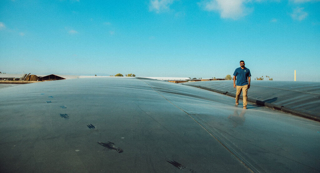 Aemetis worker walking on biogas bubble