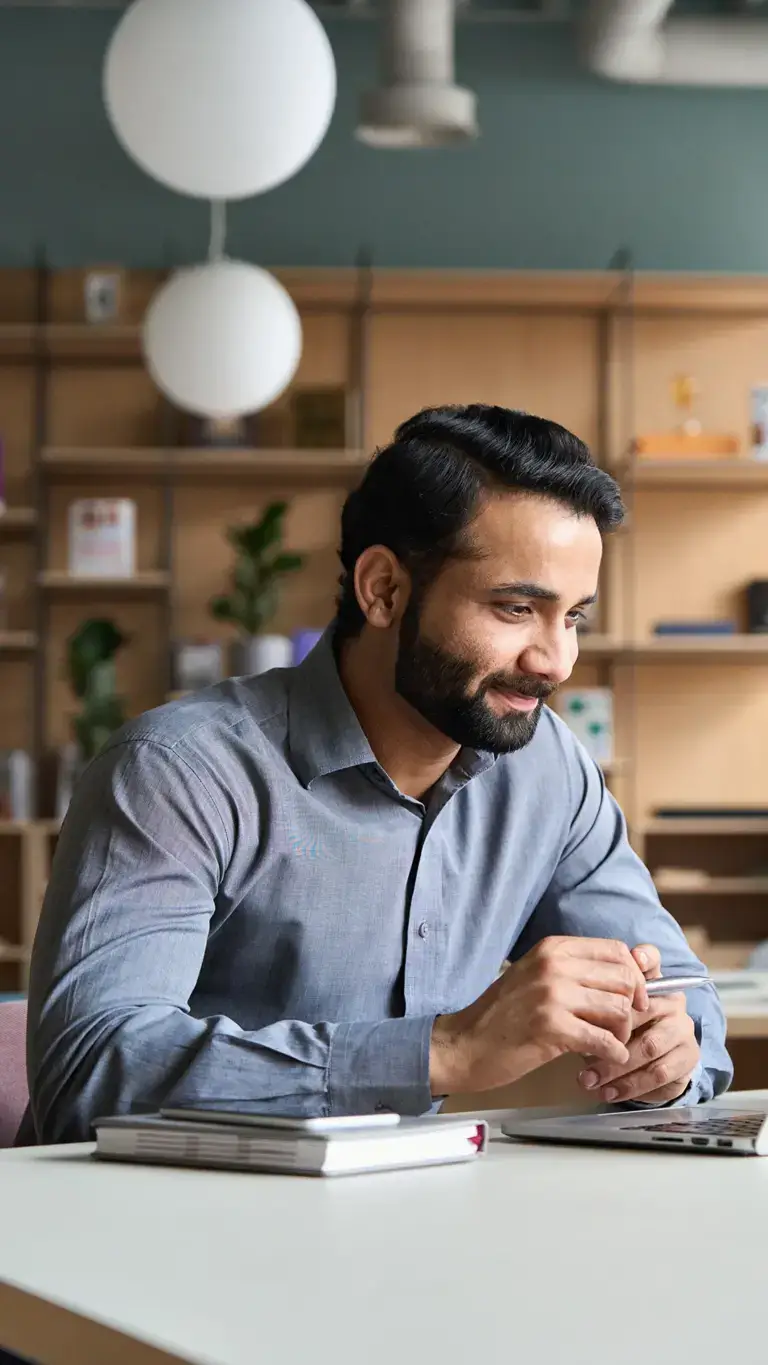 small business owner looking at a laptop for sba 7a loan information