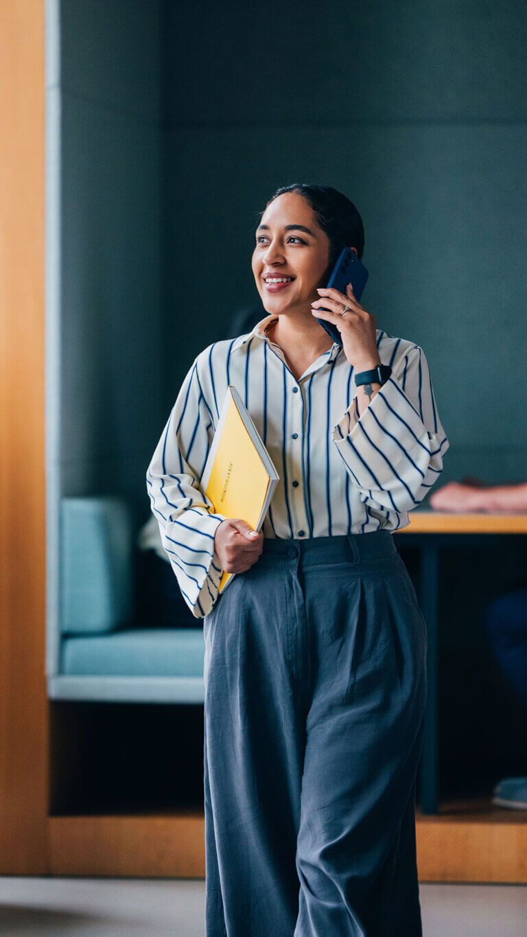Business professional on the phone discussing business loan special asset services.