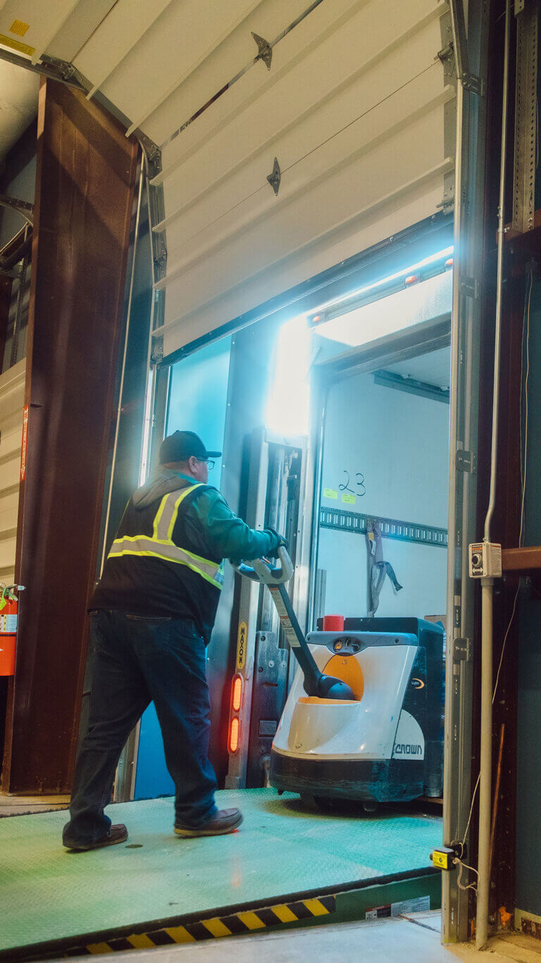 Worker loading up cargo as part of a commercial special asset service request.