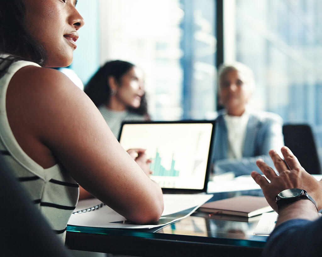 Business professional meeting about commercial loan credit administration service options.